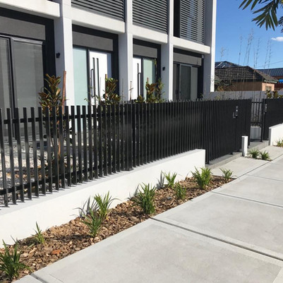 House with Slat Fencing